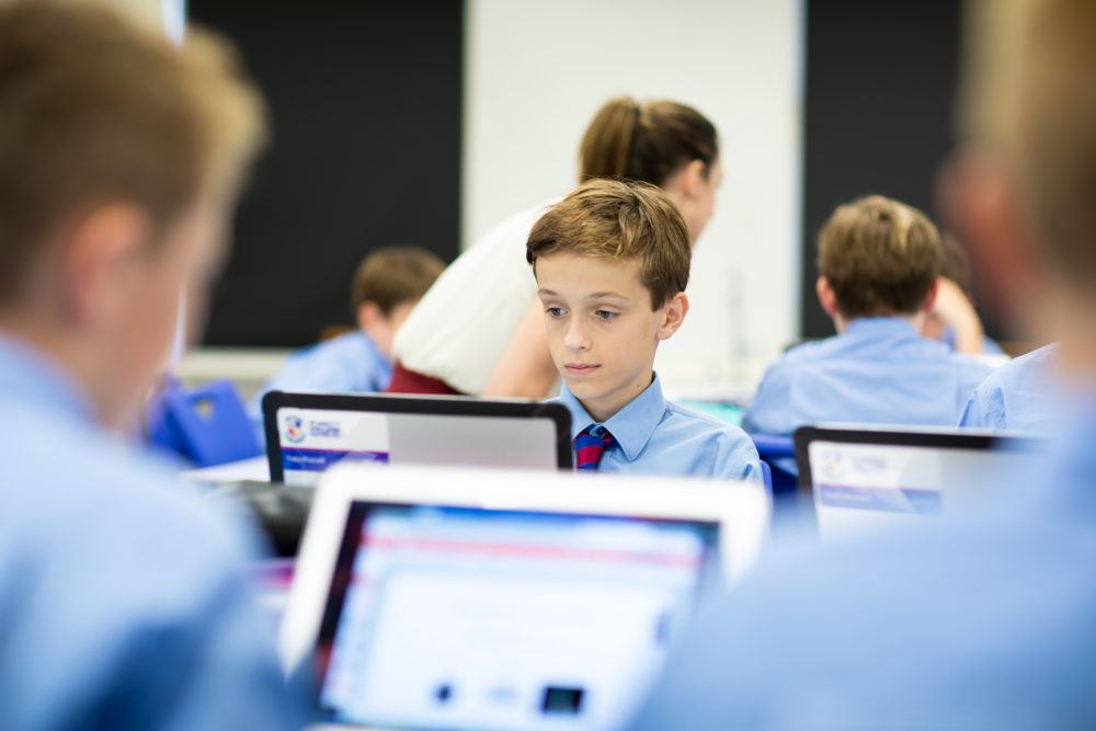 boy in class on computer