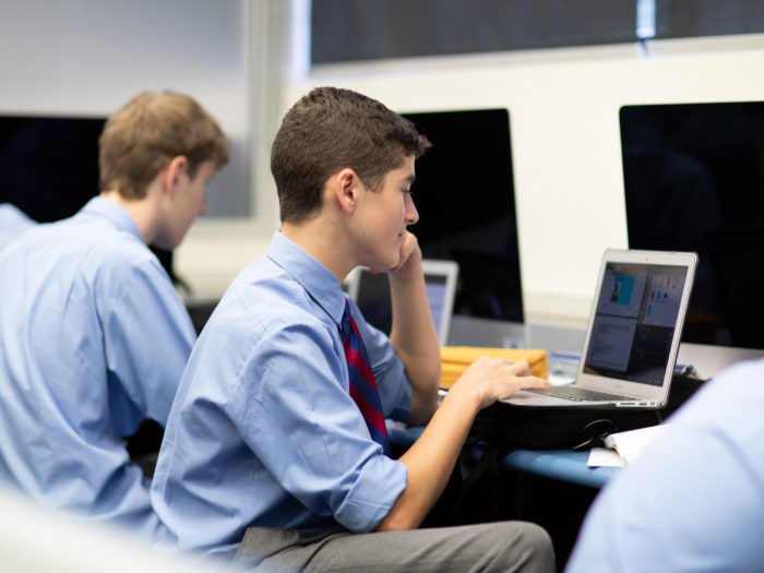 boys in classroom on computer