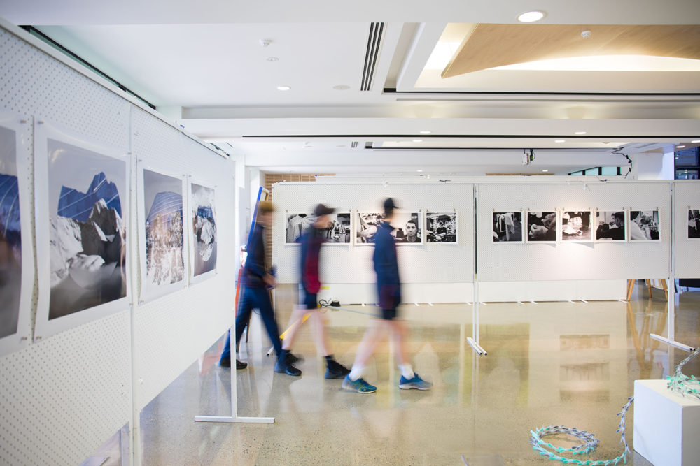 boys walking through Art Exhibition