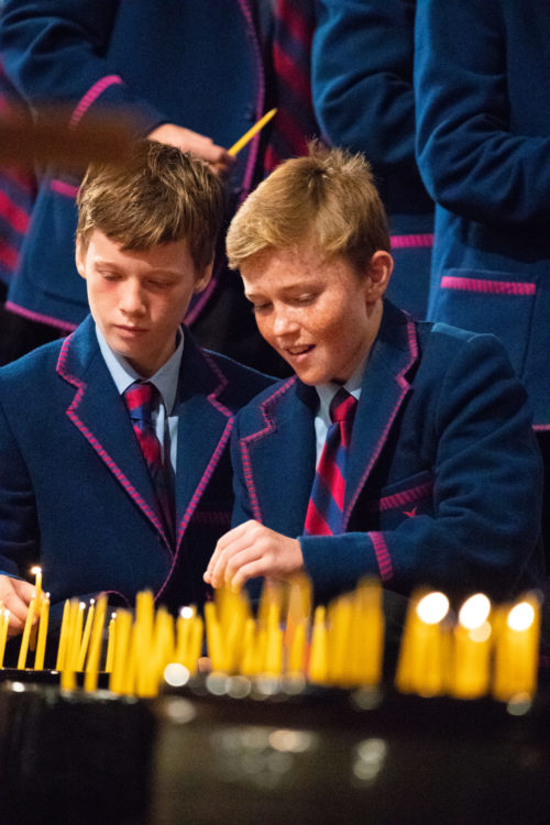 boys lighting candles