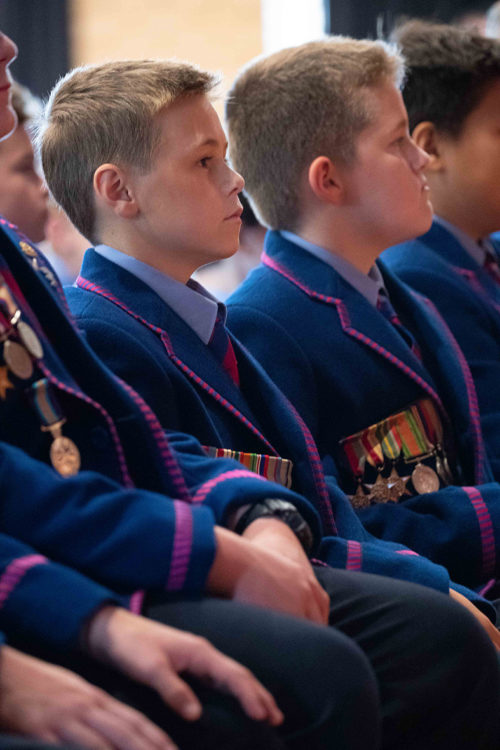 row of students in uniform sitting
