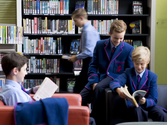 boys reading in library