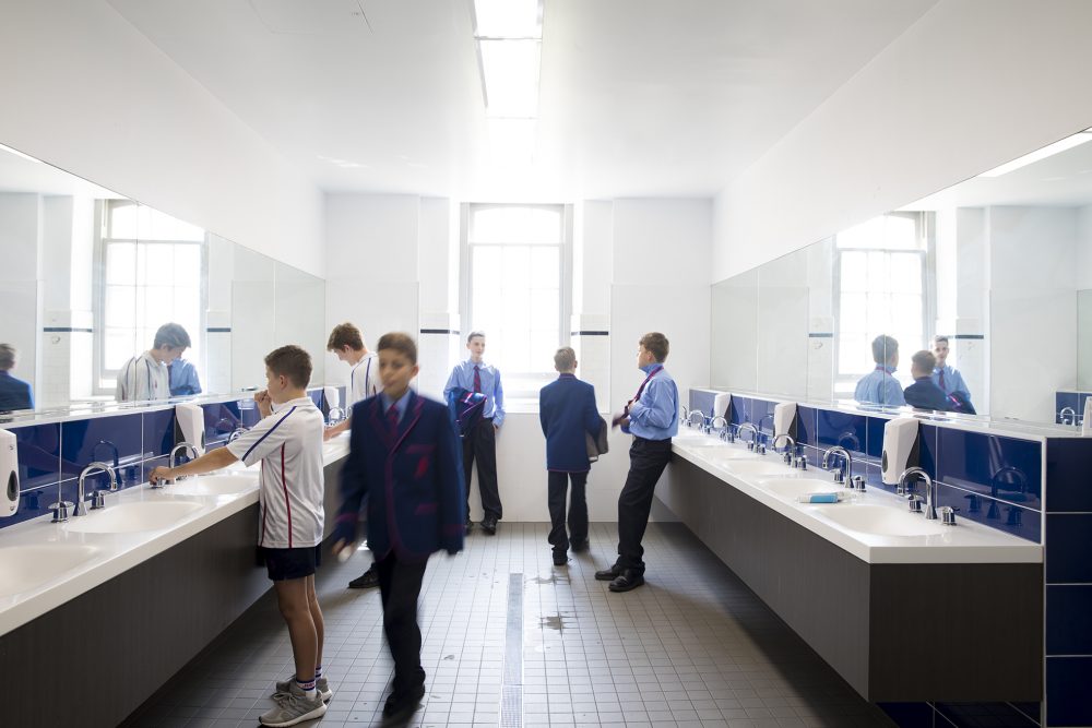 Boys getting ready for school in bathroom